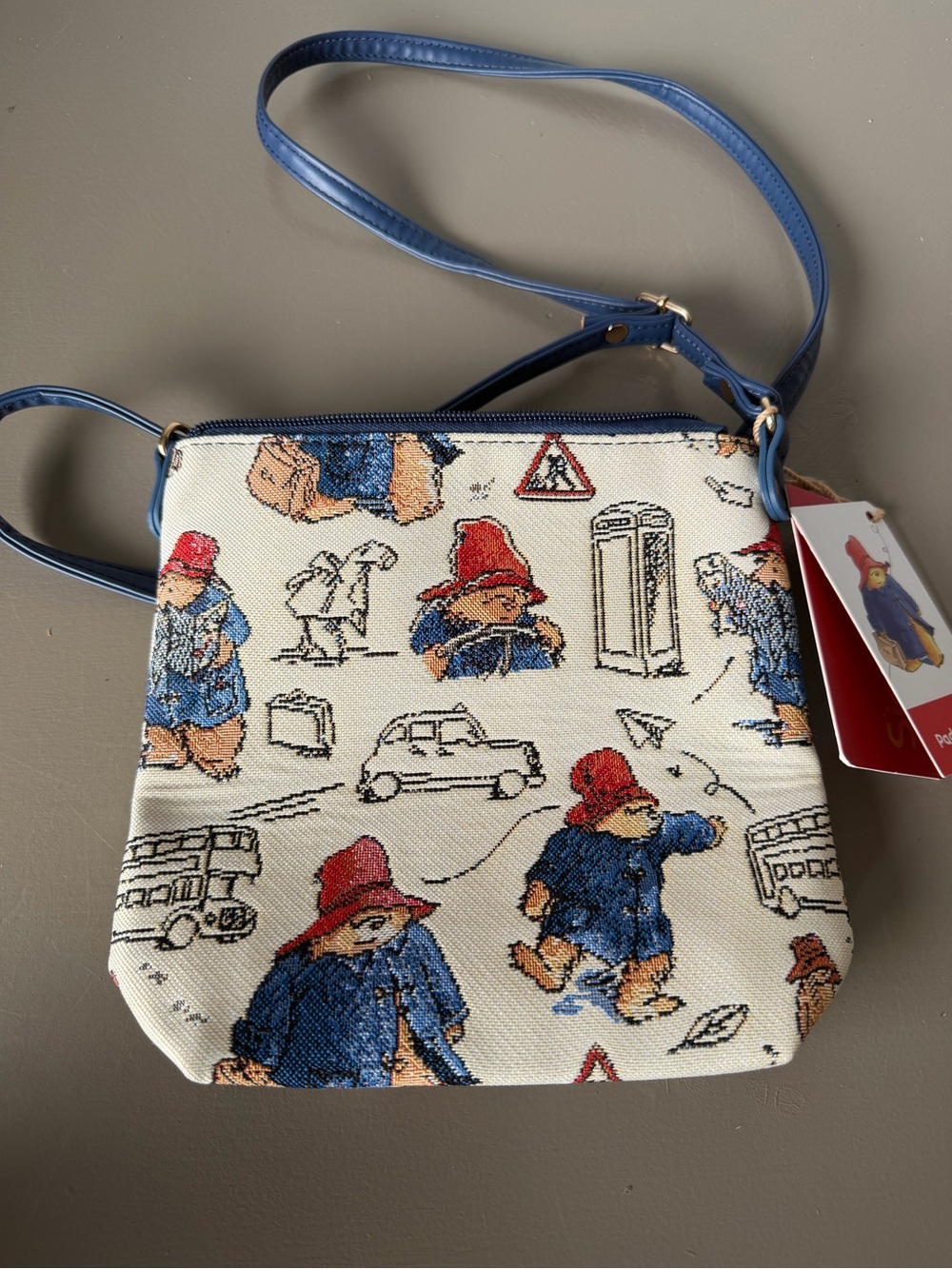bebe Cream Crossbody Bag with Blue, Red & Brown Paddington Bear Print